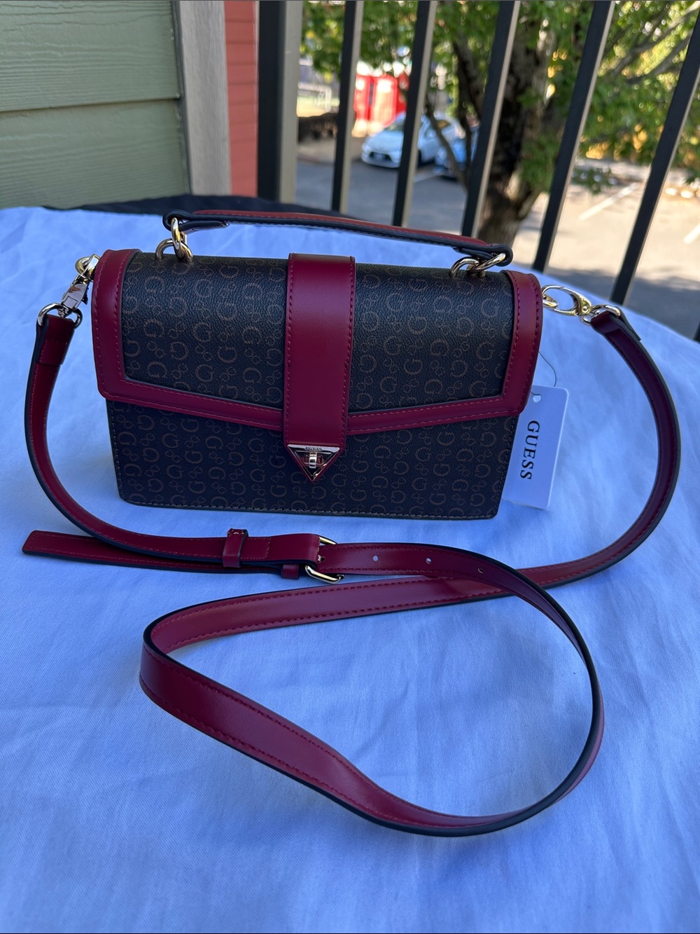 GUESS Brown Signature Crossbody with Burgundy Trim.